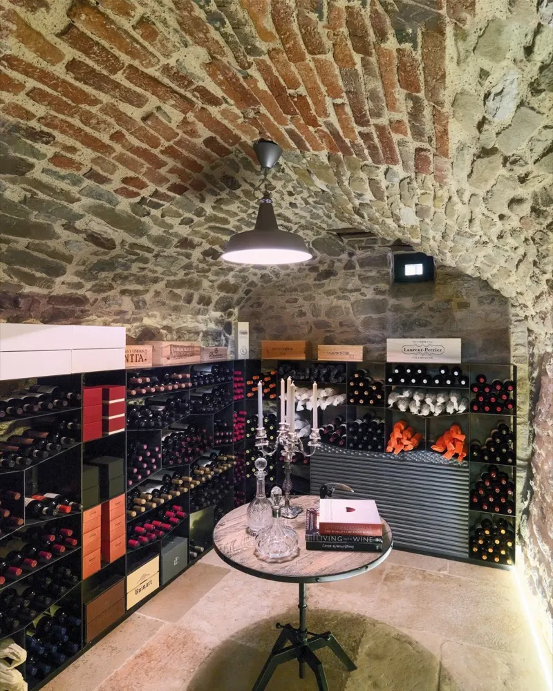 The bottle cellar, under its brick vault