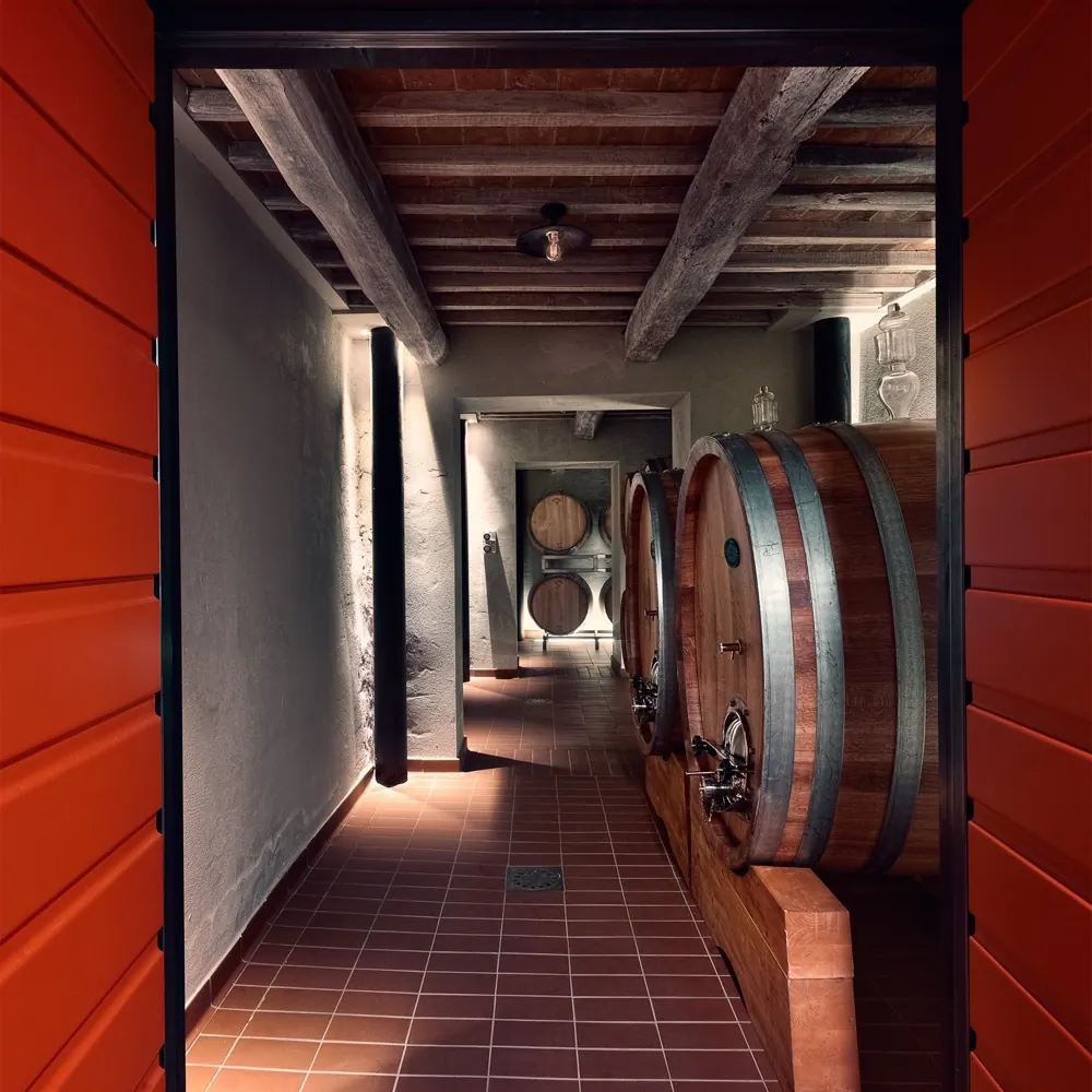 The length of the cellar, through the red doors